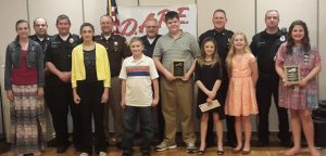 Back row: Argos Police Chief Corey Bowman, Bremen Police Sergeant Matt Schnaible, Marshall County Sheriff Matthew Hassel, Culver Police Officer John Duhnovsky, Plymouth Asst. Police Chief Mark Owen, Bourbon Police Officer Matt Haskins; Front row: Lizzy Edmonds, Argos Schools; Ellia Foster, Saint Paul’s Lutheran School; Galen Hochstetler, Bremen Schools; Dayne Garbacik, Culver Schools; Madison Voreis, Plymouth Schools; Dorothy Karris, Saint Michael School; Brooklin Wilhite, Triton Schools.