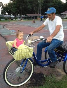 Jim Cooley and his granddaughter, Riley, are frequently spotted on his blue tricycle