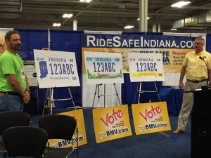 BMV Commissioner Kent Abernathy unveiled the three license plate design finalists at the Indiana State Fair. Photo provided.